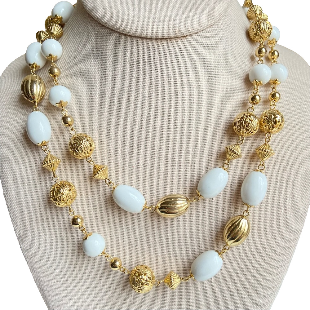 Goldtone filigree and white acrylic beads on single strand chain link necklace